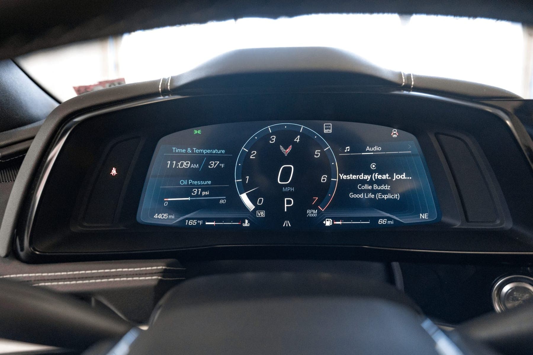 Digital instrument cluster of a Corvette Stingray showing the odometer, oil pressure and trip data