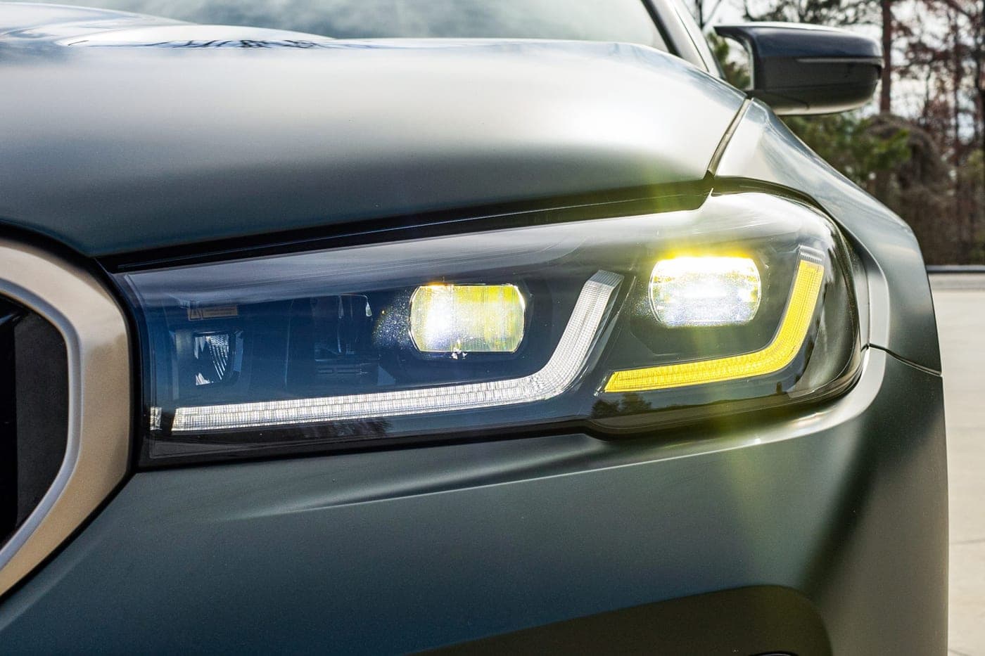 Close-up of the laser headlight and yellow daytime running light on a BMW M5 CS